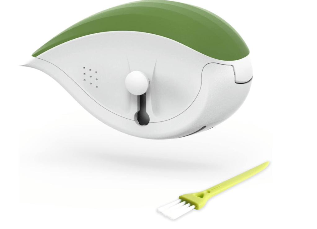 A modern hair clipper with a sleek green and white design, accompanied by a small cleaning brush in a matching green color.