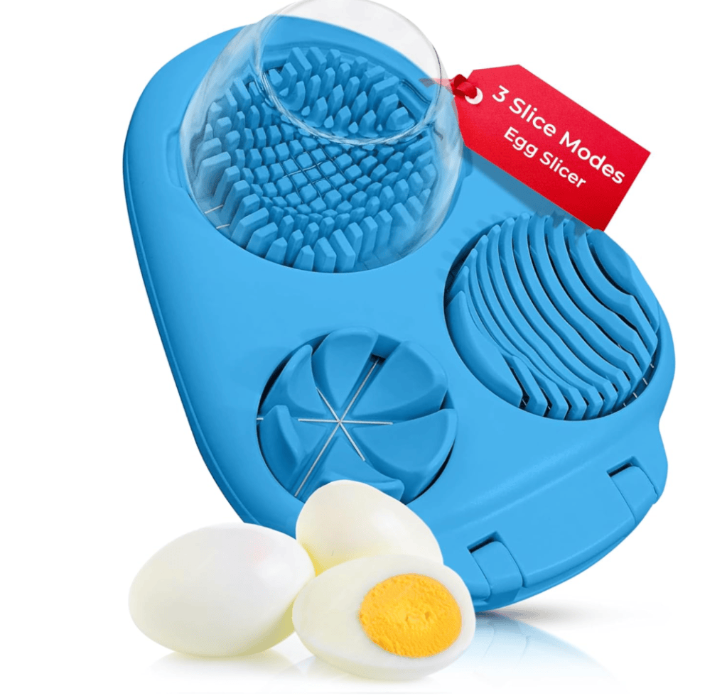 Blue egg slicer featuring three slice modes with a glass of eggs on top and cut boiled eggs beside it.