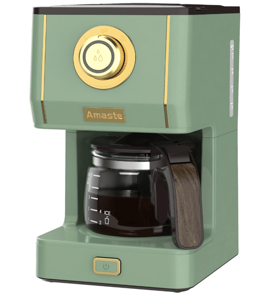 Modern green coffee maker with a gold dial and a glass carafe.